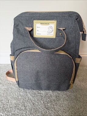 Diaper backpack with changing station